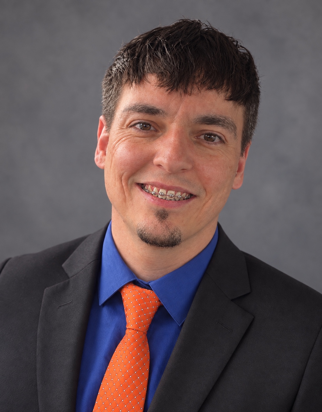 Christopher T. Perkins in professional attire